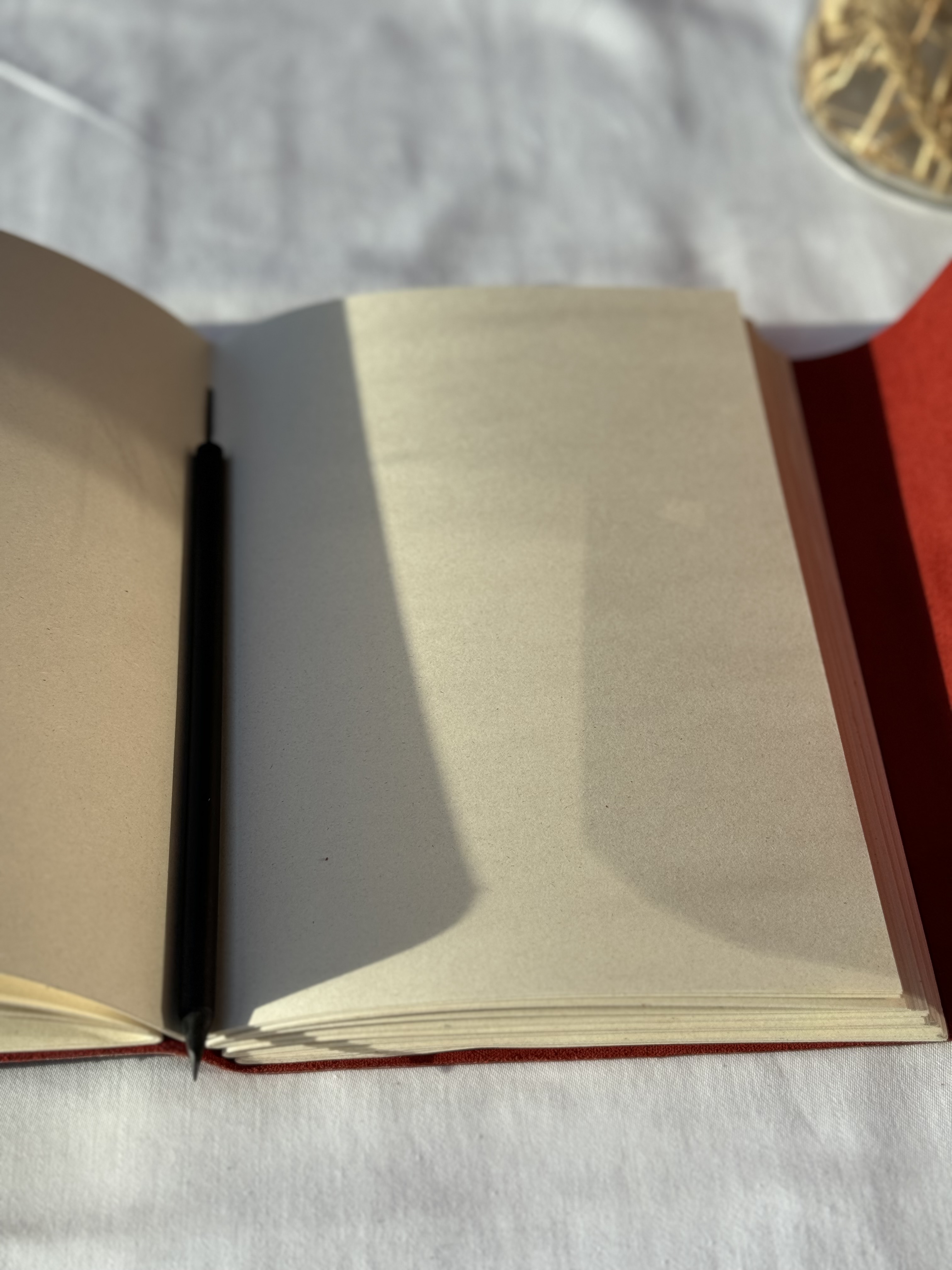 Red Notebook with Pencil