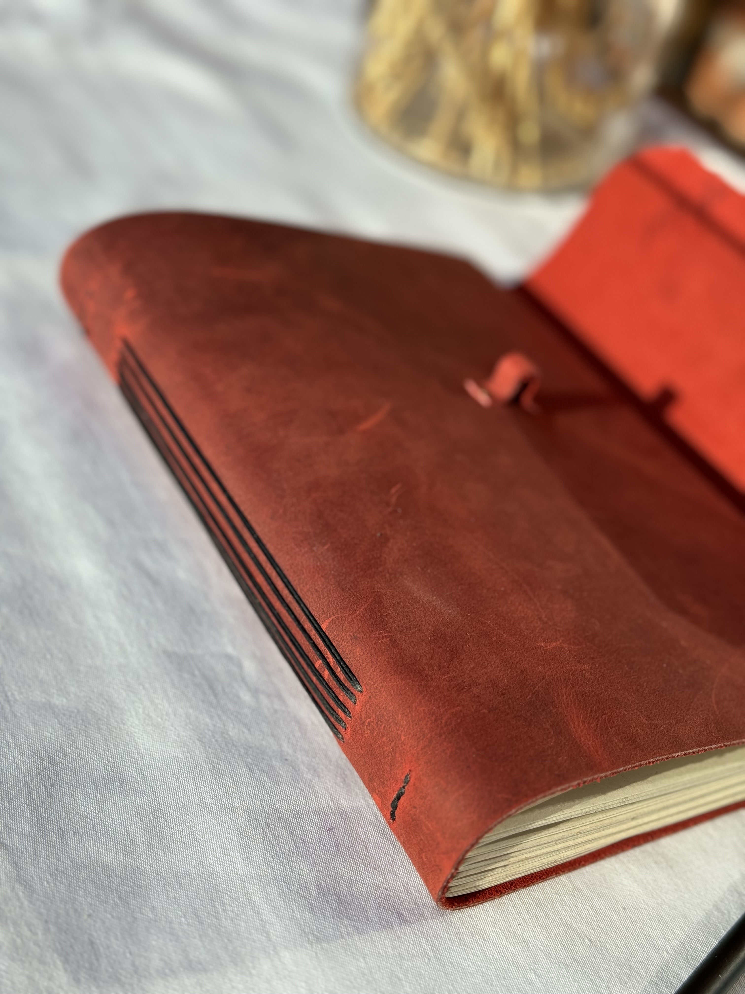 Red Notebook with Pencil