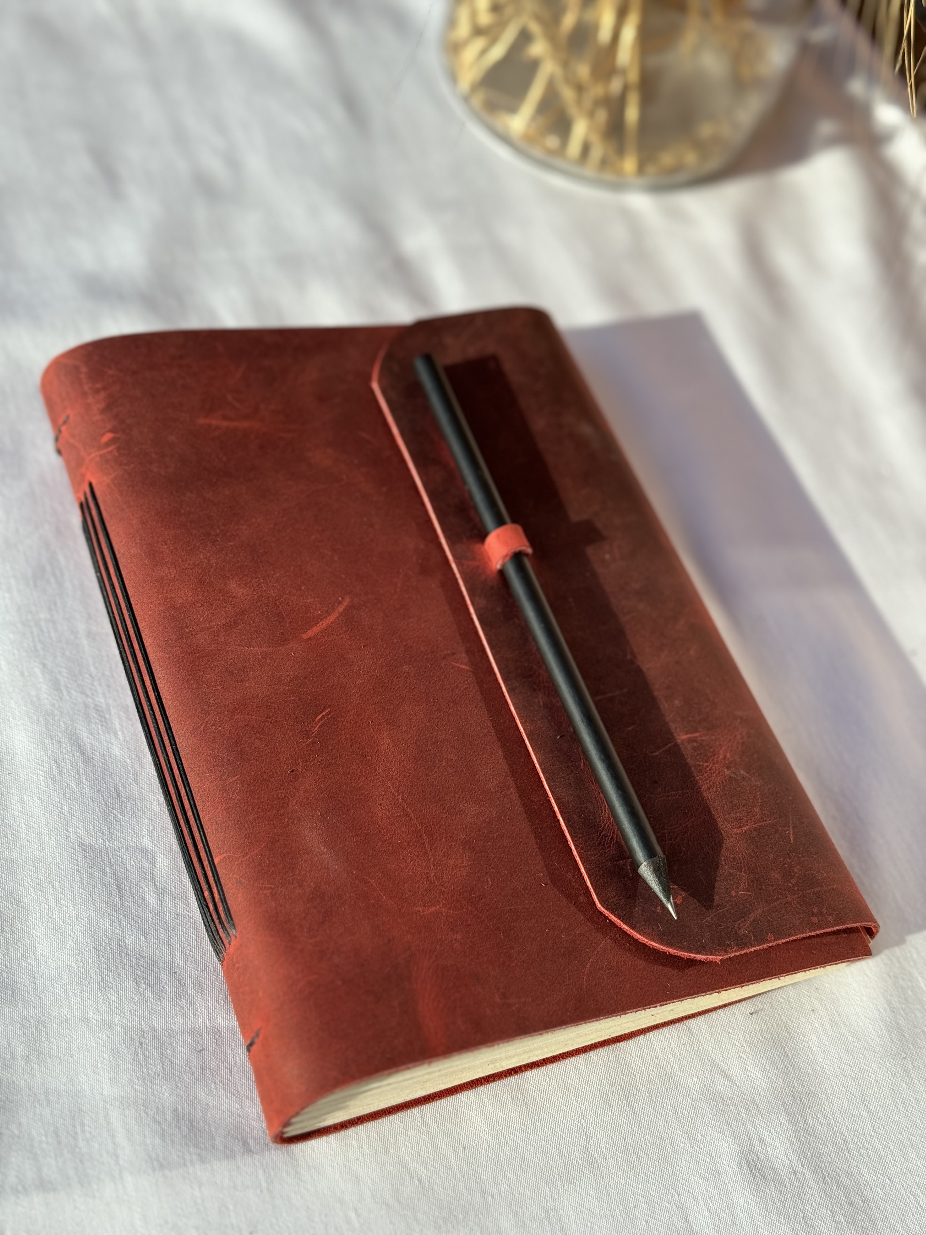 Red Notebook with Pencil